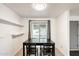 Dining area with dark wood table and chairs, natural light, and tiled flooring at 2609 N Pleasant Dr, Chandler, AZ 85225