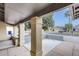 Covered front porch featuring decorative columns and desert landscaping, offering shade and curb appeal at 2609 N Pleasant Dr, Chandler, AZ 85225
