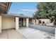 Covered front porch featuring decorative columns and desert landscaping, offering shade and curb appeal at 2609 N Pleasant Dr, Chandler, AZ 85225