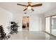 Home gym features weightlifting equipment, desk with computer, and patio doors at 2609 N Pleasant Dr, Chandler, AZ 85225