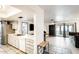 Open concept kitchen showcasing stainless steel appliances, sleek countertops, and seamless flow to the living room at 2609 N Pleasant Dr, Chandler, AZ 85225