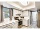 Well lit kitchen featuring stainless steel appliances, white countertops and grey cabinetry at 2609 N Pleasant Dr, Chandler, AZ 85225