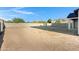 Unfinished backyard with cinder block wall offers a blank canvas for personalized landscaping at 26631 S 169Th Pl, Queen Creek, AZ 85142