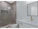 Modern bathroom with a glass-enclosed shower, white vanity, and gold hardware at 26631 S 169Th Pl, Queen Creek, AZ 85142