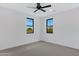Bright bedroom with neutral carpet and natural lighting from two large windows at 26631 S 169Th Pl, Queen Creek, AZ 85142