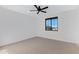 Bright bedroom with neutral carpet, a ceiling fan, and natural lighting from a window at 26631 S 169Th Pl, Queen Creek, AZ 85142