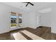Bright bedroom featuring wood floors and modern lighting at 26631 S 169Th Pl, Queen Creek, AZ 85142