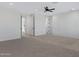 Spacious bedroom featuring a ceiling fan and decorative wall molding details at 26631 S 169Th Pl, Queen Creek, AZ 85142