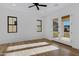 Bright bedroom with natural light, wood floors, and modern black trim at 26631 S 169Th Pl, Queen Creek, AZ 85142