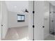 Bright bedroom featuring a ceiling fan and a view to a tiled shower at 26631 S 169Th Pl, Queen Creek, AZ 85142