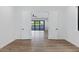 This bonus room features an open door to another area with sliding glass doors at 26631 S 169Th Pl, Queen Creek, AZ 85142