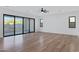 Bonus room boasts sliding glass doors, white walls and wood floors at 26631 S 169Th Pl, Queen Creek, AZ 85142