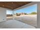 Covered patio with wood ceiling detail and a spacious concrete area leading to the backyard at 26631 S 169Th Pl, Queen Creek, AZ 85142