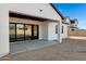 View from the covered patio of the white exterior home with sliding glass doors to the backyard at 26631 S 169Th Pl, Queen Creek, AZ 85142