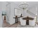 Chic dining room with modern chandelier, stylish seating, and convenient access to the kitchen area at 26631 S 169Th Pl, Queen Creek, AZ 85142