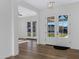Bright foyer showcasing wood floors, fresh white trim, and modern lighting at 26631 S 169Th Pl, Queen Creek, AZ 85142