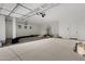 Spacious three car garage with high ceilings and ample space for vehicles and storage at 26631 S 169Th Pl, Queen Creek, AZ 85142