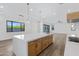 Open kitchen featuring custom cabinets, stainless steel appliances, large center island and view to dining area at 26631 S 169Th Pl, Queen Creek, AZ 85142