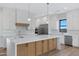 Bright kitchen features custom cabinets, stainless steel appliances, and a large center island at 26631 S 169Th Pl, Queen Creek, AZ 85142