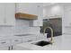 Close up of a kitchen featuring a stainless steel refrigerator, white cabinets, and gold hardware at 26631 S 169Th Pl, Queen Creek, AZ 85142