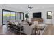 Spacious living room with comfortable seating, modern entertainment setup, and access to outdoor area at 26631 S 169Th Pl, Queen Creek, AZ 85142