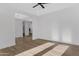 Open-concept living room showcasing sleek wood floors and crisp white walls at 26631 S 169Th Pl, Queen Creek, AZ 85142