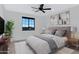 Relaxing main bedroom with a plush bed, stylish artwork, and convenient side tables with lamps at 26631 S 169Th Pl, Queen Creek, AZ 85142