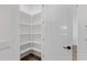 View of walk-in pantry featuring custom shelving for ample storage solutions at 26631 S 169Th Pl, Queen Creek, AZ 85142