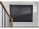 A close up of the black shiplap accent wall near the staircase in the foyer of this new home at 26643 S 169Th Pl, Queen Creek, AZ 85142