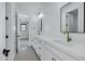Bright bathroom with double vanity, framed mirrors, and white quartz countertops at 26643 S 169Th Pl, Queen Creek, AZ 85142