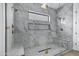 Luxurious bathroom features a glass shower with gold fixtures and marble-like tiling at 26643 S 169Th Pl, Queen Creek, AZ 85142