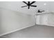 Large bedroom with neutral walls, carpet, and ceiling fans at 26643 S 169Th Pl, Queen Creek, AZ 85142