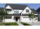 Beautiful two-story home showcasing its white exterior, dark roof, and manicured green lawn at 26643 S 169Th Pl, Queen Creek, AZ 85142