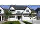 Attractive two-story home showcasing its white exterior, dark roof, and manicured green lawn at 26643 S 169Th Pl, Queen Creek, AZ 85142