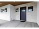 A close up of the front door, siding, and stone exterior of this beautiful new construction home at 26643 S 169Th Pl, Queen Creek, AZ 85142