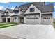 Charming new construction home with a manicured lawn, long driveway, and a three car garage at 26643 S 169Th Pl, Queen Creek, AZ 85142