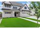 Charming new construction home with a manicured lawn, long driveway, and a three car garage at 26643 S 169Th Pl, Queen Creek, AZ 85142