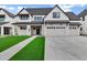 Charming new construction home with a manicured lawn, long driveway, and a three car garage at 26643 S 169Th Pl, Queen Creek, AZ 85142