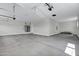 Large garage with concrete floors, and access to utilities and water heaters at 26643 S 169Th Pl, Queen Creek, AZ 85142