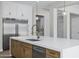 A large kitchen island with seating, stainless steel appliances, quartz counters and a modern faucet at 26643 S 169Th Pl, Queen Creek, AZ 85142