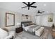 Spacious main bedroom featuring neutral colors, plush bedding, and ample natural light at 26643 S 169Th Pl, Queen Creek, AZ 85142