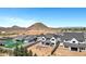 Home with a pool under construction, with desert landscape and homes in the distance at 26655 S 169Th Pl, Queen Creek, AZ 85142