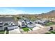 Expansive view showcasing new construction with green lawns, desert landscape, and mountain views at 26655 S 169Th Pl, Queen Creek, AZ 85142