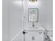 Modern powder room with a sleek vanity, elegant fixtures, and a contemporary mirror at 26655 S 169Th Pl, Queen Creek, AZ 85142