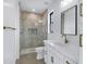 Bathroom featuring a glass shower, white vanity, quartz countertop, and bronze hardware at 26655 S 169Th Pl, Queen Creek, AZ 85142