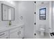 Modern bathroom features white cabinets, quartz countertop, brushed gold fixtures, and a toilet room at 26655 S 169Th Pl, Queen Creek, AZ 85142