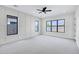 Spacious bedroom with ample natural light, stylish ceiling fan, and modern trim at 26655 S 169Th Pl, Queen Creek, AZ 85142