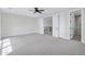 Spacious bedroom with gray carpet, featuring access to the staircase, bathroom and other rooms at 26655 S 169Th Pl, Queen Creek, AZ 85142
