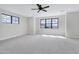 Spacious bedroom featuring neutral walls, carpet, a modern ceiling fan, and well-lit with natural light at 26655 S 169Th Pl, Queen Creek, AZ 85142