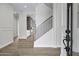 Bright foyer with a wood staircase and accent wall that leads into an open-concept space at 26655 S 169Th Pl, Queen Creek, AZ 85142